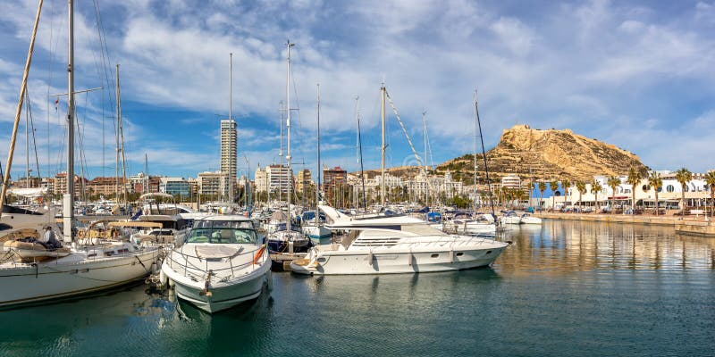Alicante Port d`Alacant marina with boats and view of castle Castillo travel traveling holidays vacation panorama in Spain