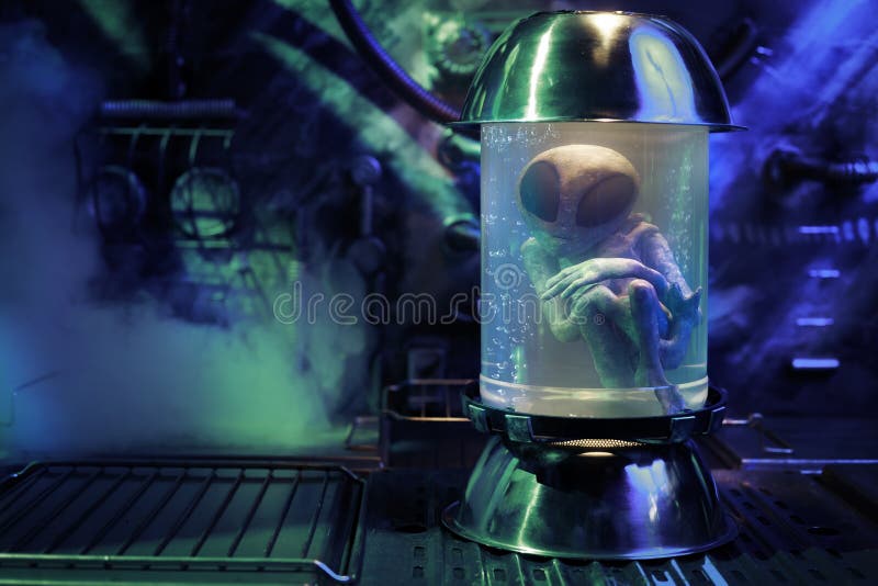 Alien inside a test tube royalty free stock photo