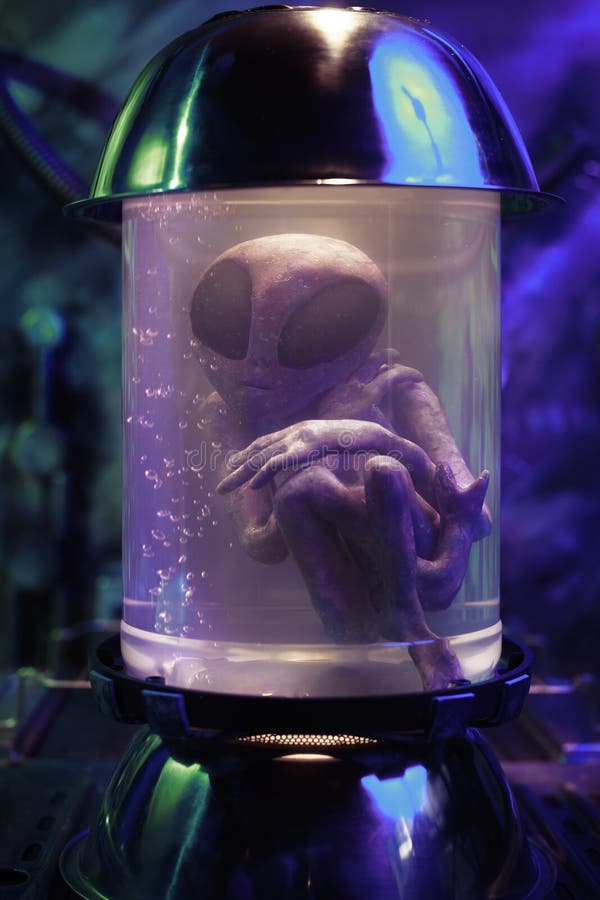 Alien inside a test tube stock photos