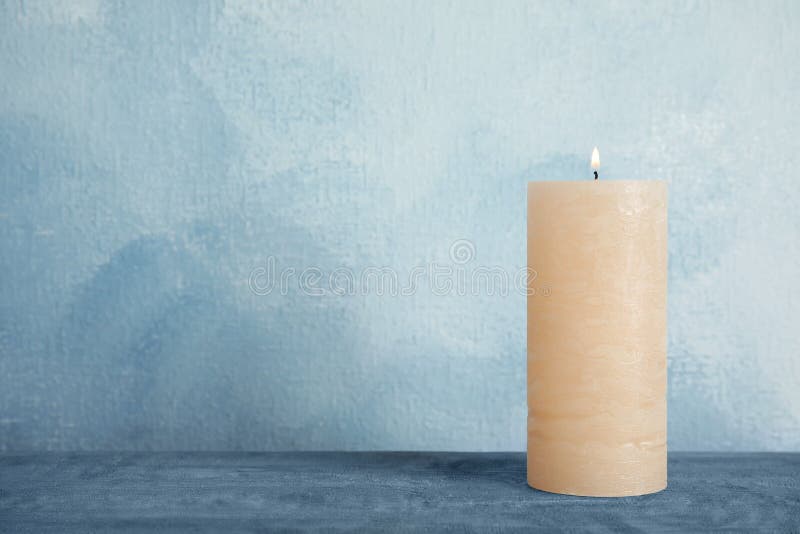Alight wax candle on table stock image. Image of candlewick 150673641