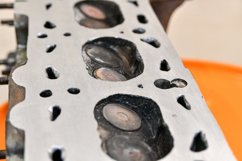 Aligned and Ground Cylinder Head with an Abrasive Stone on a Surface