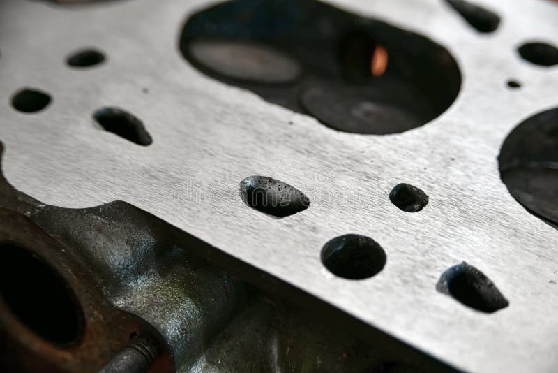 Aligned and Ground Cylinder Head with an Abrasive Stone on a Surface