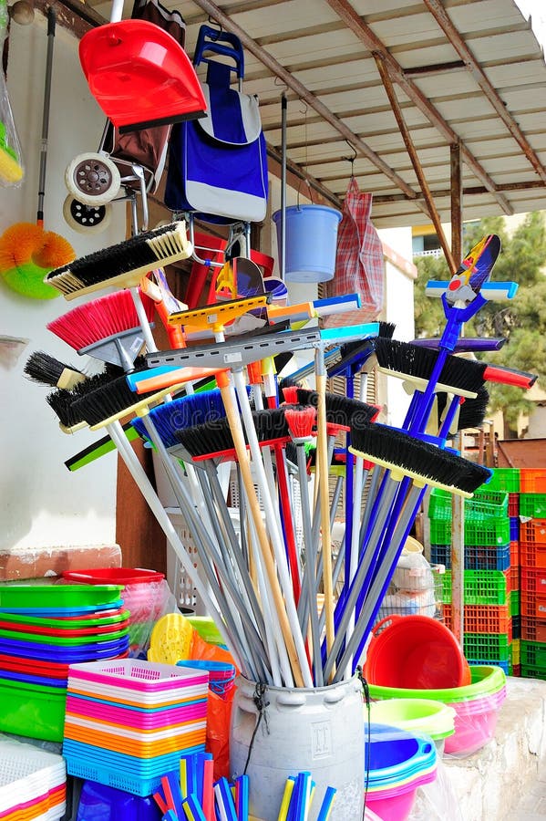 Colorful brooms and cleaning supplies. Colorful brooms and cleaning supplies