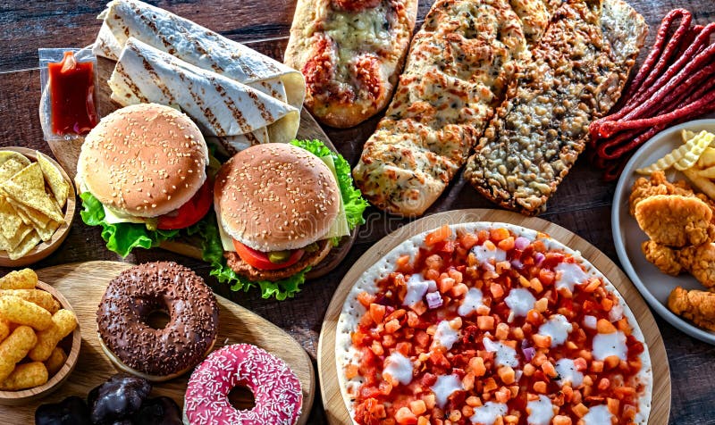 Alimentos que aumentan el riesgo de cáncer. comida chatarra fotografía de archivo libre de regalías