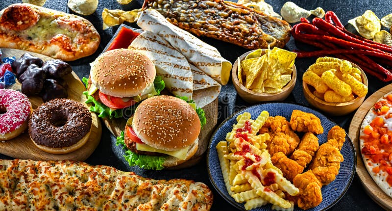 Alimentos que aumentan el riesgo de cáncer. Comida chatarra fotografía de archivo