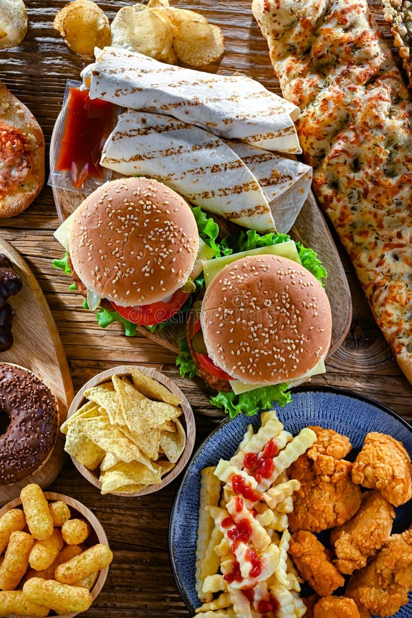 Alimentos que aumentan el riesgo de cáncer. Comida chatarra fotografía de archivo libre de regalías