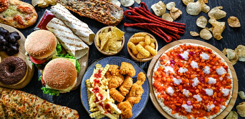 Alimentos que aumentan el riesgo de cáncer. Comida chatarra fotografía de archivo libre de regalías