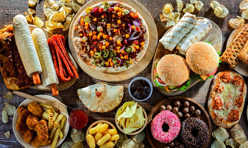 Alimentos que aumentan el riesgo de cáncer. Comida chatarra fotos de archivo