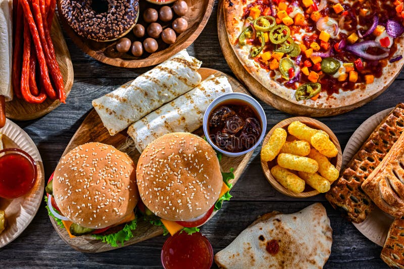 Alimentos que aumentan el riesgo de cáncer. Comida chatarra foto de archivo libre de regalías