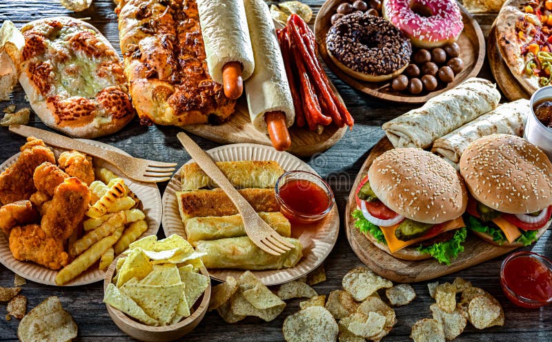 Alimentos que aumentan el riesgo de cáncer. Comida chatarra imagenes de archivo