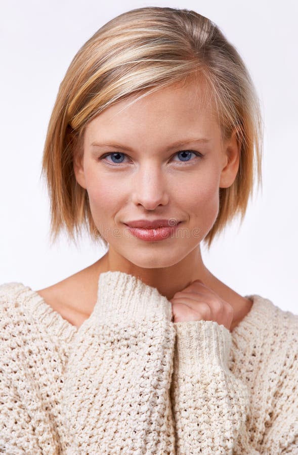 All natural style and beauty. Studio portrait of a beautiful smiling young woman isolated on white.