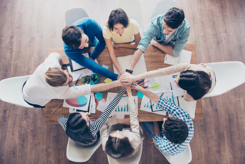 All together! Conception of successful teambuilding. Topview of royalty free stock photo All together! Conception of successful teambuilding. Topview of royalty free stock photo