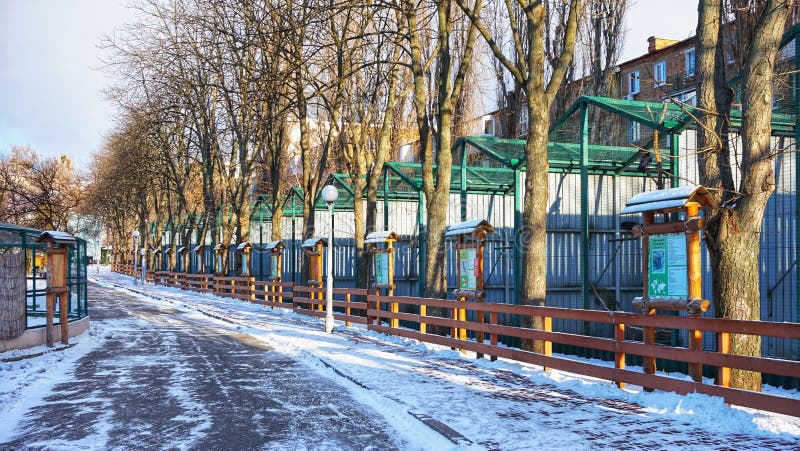 Alley with aviaries for birds of prey in the Kiev zoo.