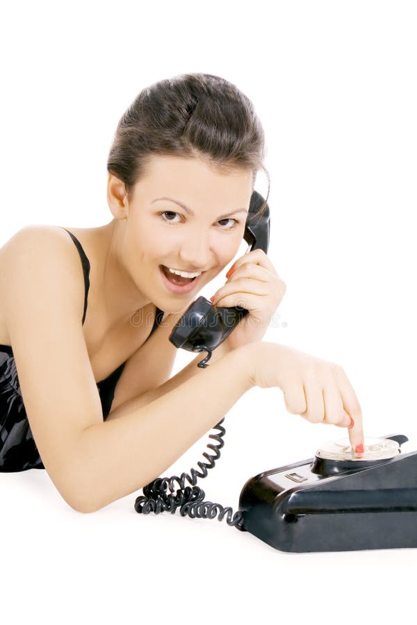 Alluring girl calling at the phone