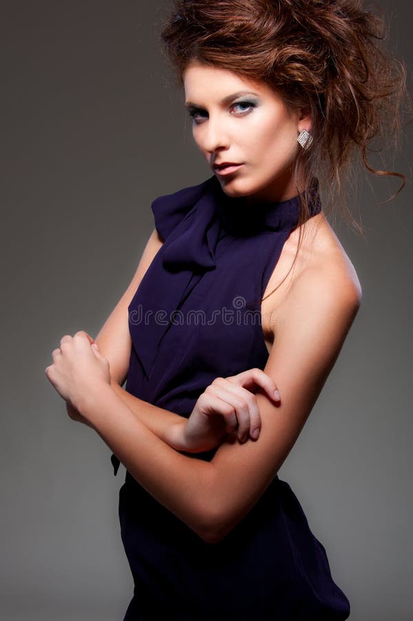 Beautiful Ladylike Woman with Dark Hair in Elegant Coat and Leather