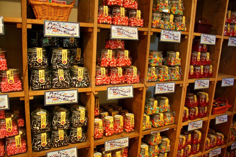 Assorted colourful candy jars in the shelves of a candy store. Assorted colourful candy jars in the shelves of a candy store