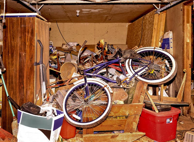 A basement storage area with bicycles and other things left in an abandoned house. Concept for foreclosure, bankruptcy, etc. A basement storage area with bicycles and other things left in an abandoned house. Concept for foreclosure, bankruptcy, etc.