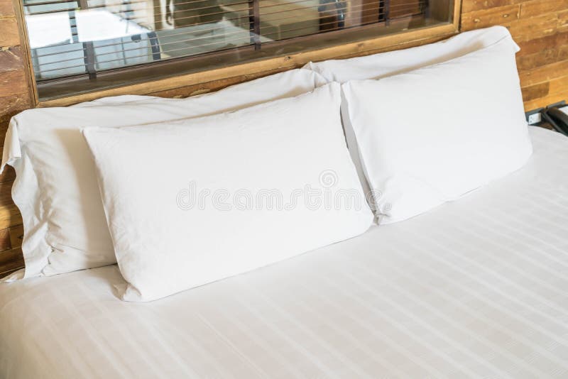 white pillow on bed interior decoration in bedroom. white pillow on bed interior decoration in bedroom