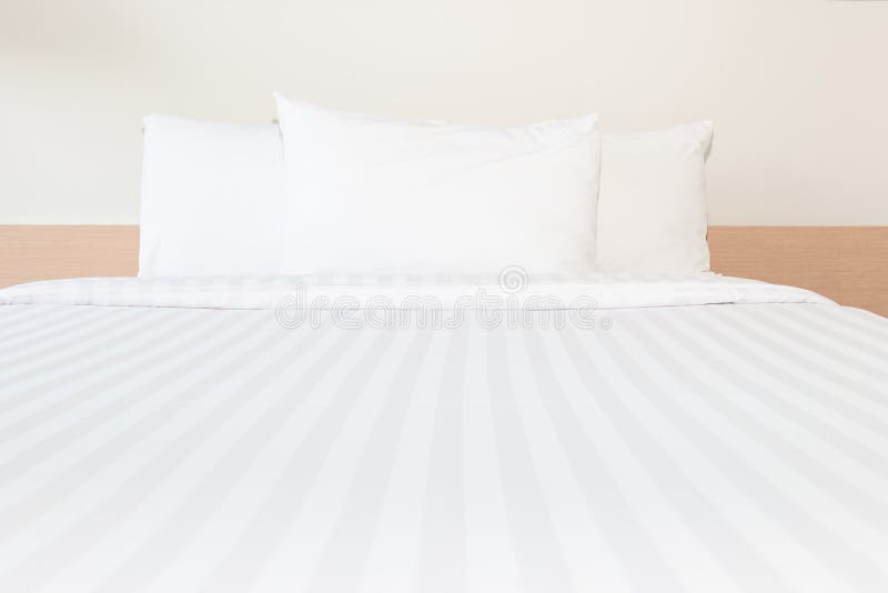 White pillow and white bed in bed room for clean and comfort sleep. White pillow and white bed in bed room for clean and comfort sleep