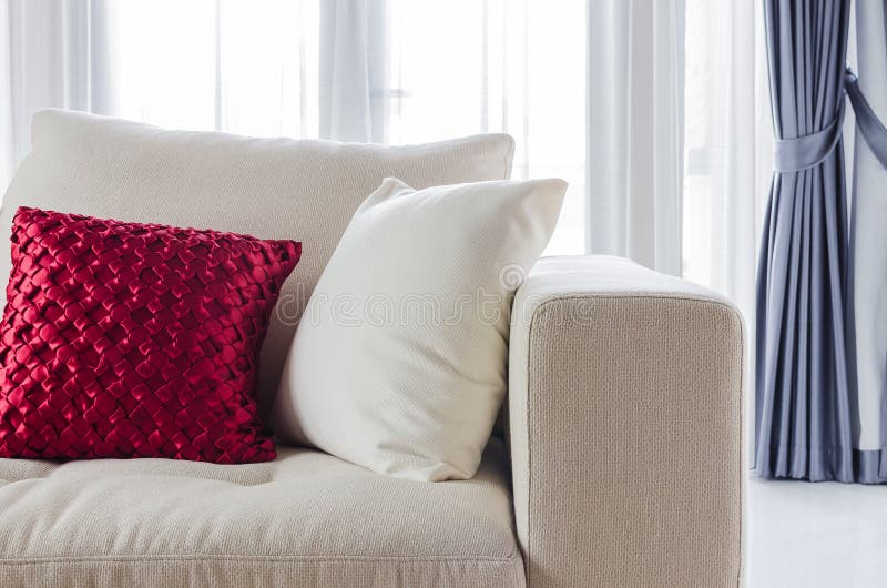 Red and white pillow on white sofa at home. Red and white pillow on white sofa at home