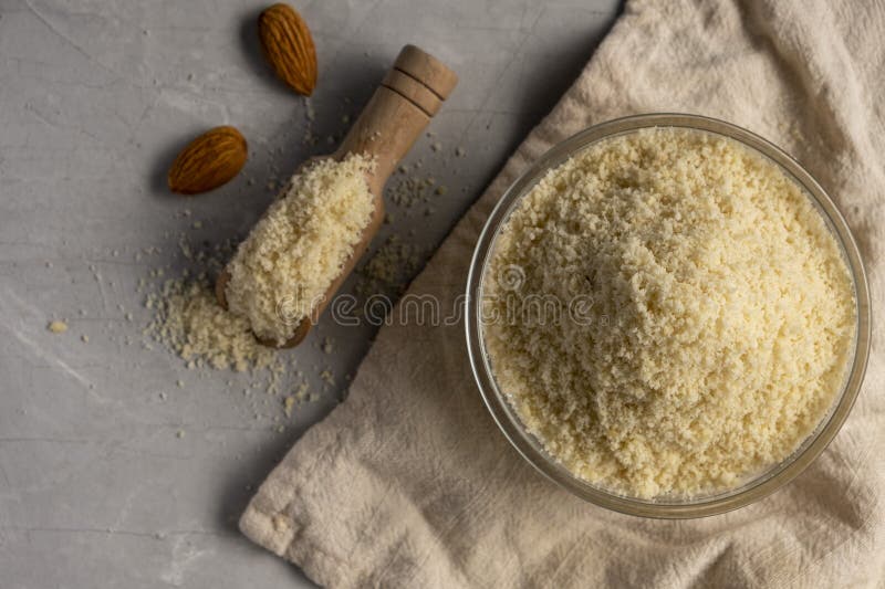 Almond Flour and Almonds in Bowls. Gluten Free Food Concept. Stock