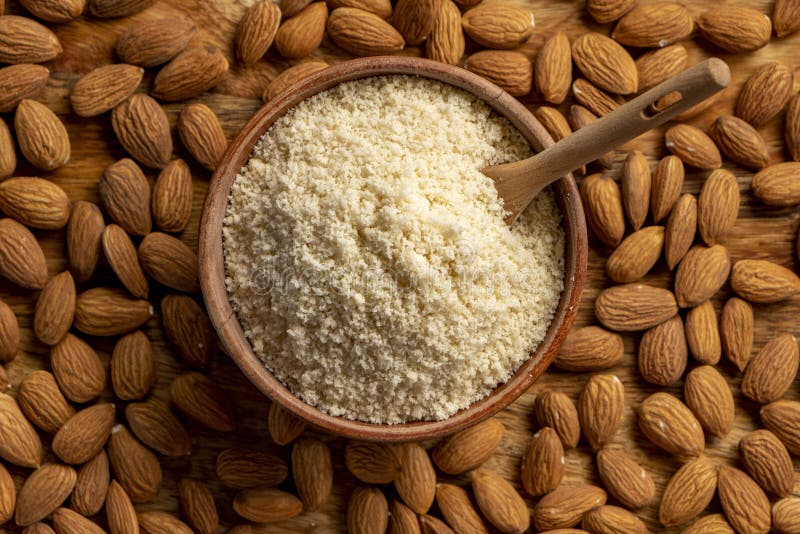 Almond Flour and Almonds in Bowls. Gluten Free Food Concept. Stock
