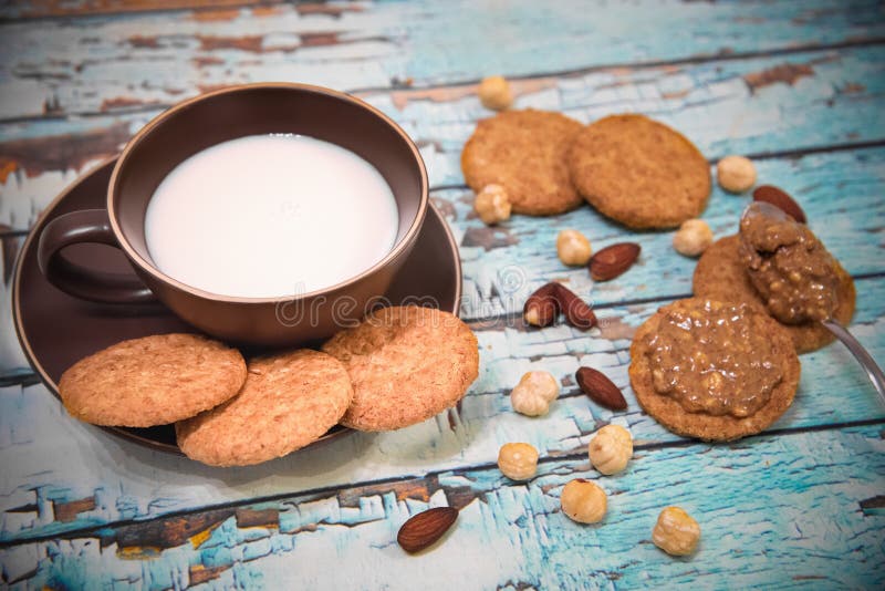 Almond milk, whole grain cookies and peanut butter for breakfast. Seen from above royalty free stock image