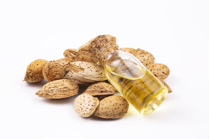 Almond Oil on the White Background. Organic Herbal Oil Stock Photo