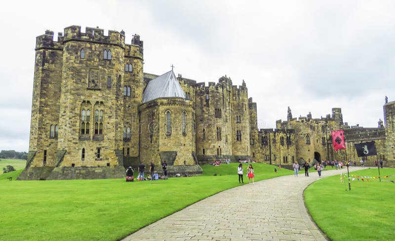 Alnwick Castle inside the walls with visitors, August 2nd, 2016 - in the English county of Northumberland, UK. Alnwick Castle inside the walls with visitors, August 2nd, 2016 - in the English county of Northumberland, UK