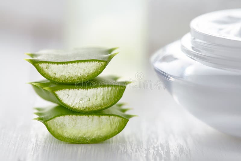 Aloe vera herbal slices healthy natural cosmetic dermatology medicine anti wrinkle product with cream on white background. Aloe vera herbal slices healthy natural cosmetic dermatology medicine anti wrinkle product with cream on white background