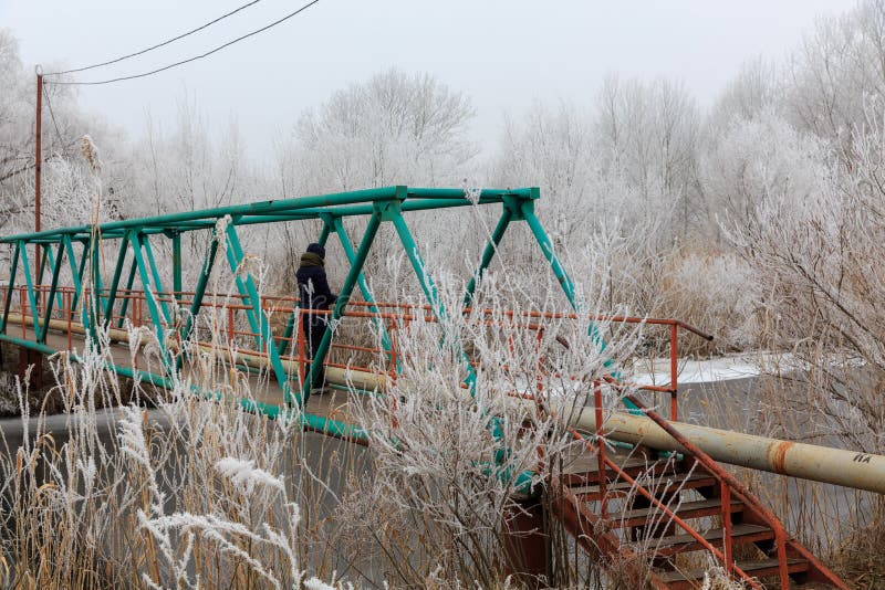 Bridge may ice in cold weather sign