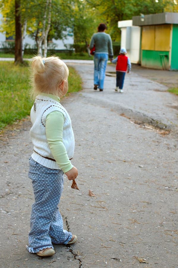 Alone little girl see on family (mother and son).