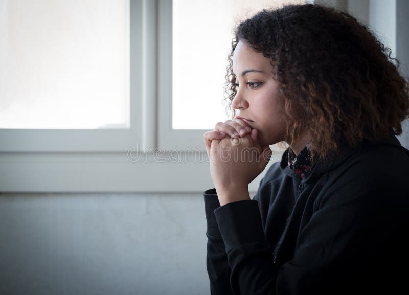 Alone and lonely young girl feeling depressed royalty free stock photography