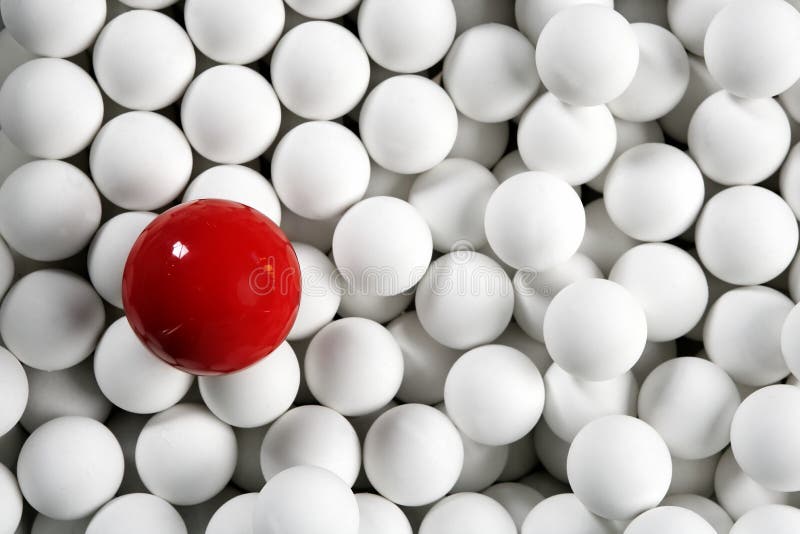 Alone one billiard red ball little white balls