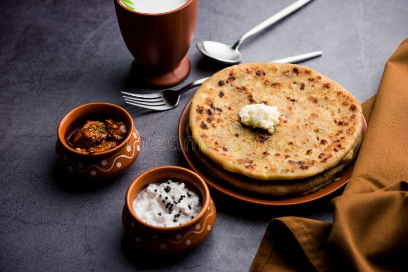 Aloo Paratha / Indian Potato stuffed Flatbread. Served with fresh fresh Lassi / Lassie or buttermilk