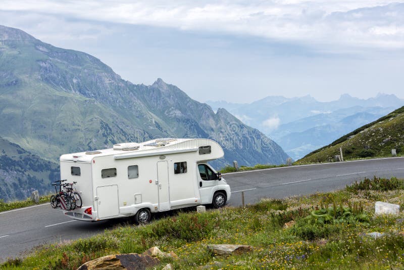 Motorhome speeding on alpine road, Eastern Alps. Motorhome speeding on alpine road, Eastern Alps