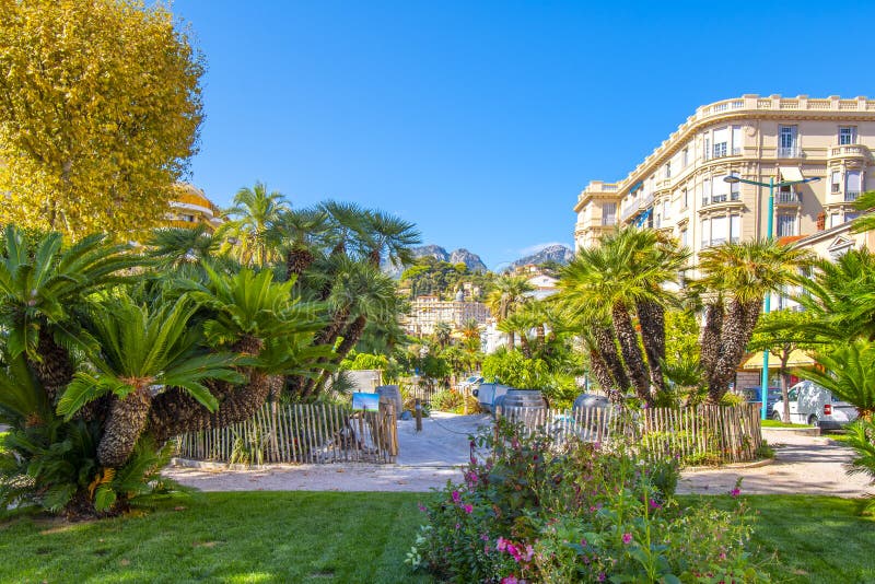 The Alpes Maritimes mountains rise behind the Jardins Bioves in the city center of the seaside village of Menton, France. royalty free stock image The Alpes Maritimes mountains rise behind the Jardins Bioves in the city center of the seaside village of Menton, France. royalty free stock image