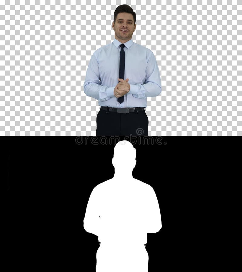 Young businessman walking in frame and talking to camera presenting something, Alpha Channel royalty free stock photography