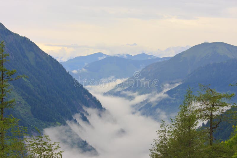 Mountains in the Hohe Tauern National Park seen from the Grossglockner High Alpine Road, the most famous alpine road leading into the heart of the National Park, to the highest mountain in Austria, the Grossglockner (3,798m) and its glacier, the Pasterze; passing through all of the vegetation zones from cornfields to the eternal ice. Mountains in the Hohe Tauern National Park seen from the Grossglockner High Alpine Road, the most famous alpine road leading into the heart of the National Park, to the highest mountain in Austria, the Grossglockner (3,798m) and its glacier, the Pasterze; passing through all of the vegetation zones from cornfields to the eternal ice.