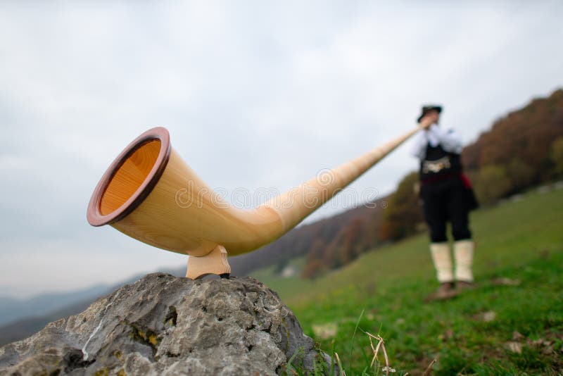 Alpine Horn. a Man Plays in an Alpine Valley Stock Photo Image of horns, tradition 129712164