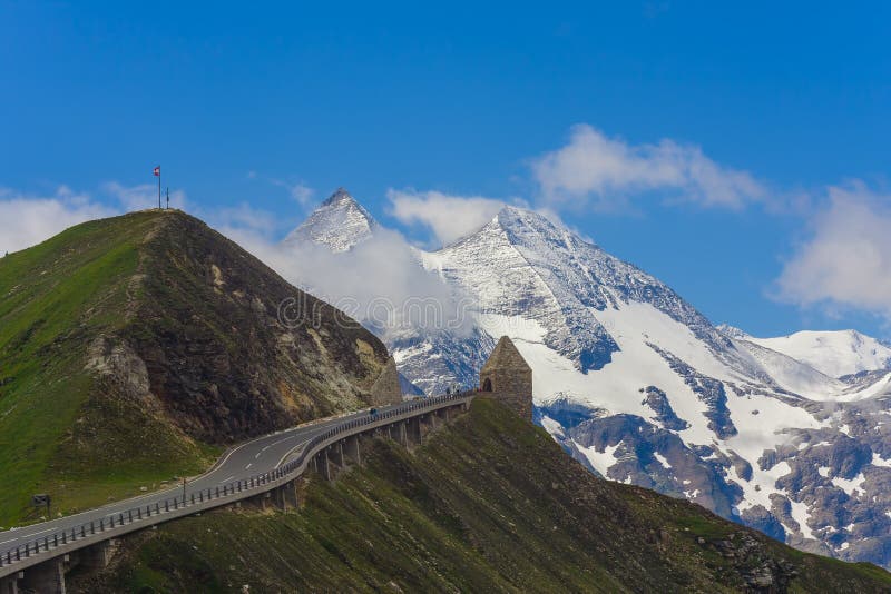 Alpine mountain peak with blue sky background. Grossglockner, Austria