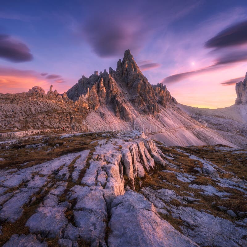 Alpine mountains at colorful sunset in autumn in Dolomites, Italy stock photos