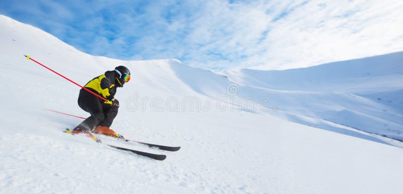 Alpine skier skiing in mountains stock photos Alpine skier skiing in mountains stock photos