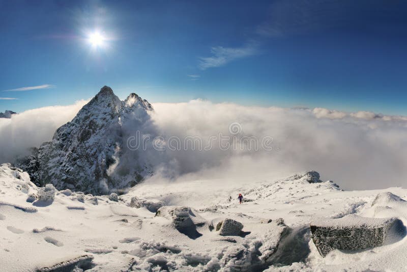 Alpinist climbing on Rysy mountain peak in High Tatras. Slovakia