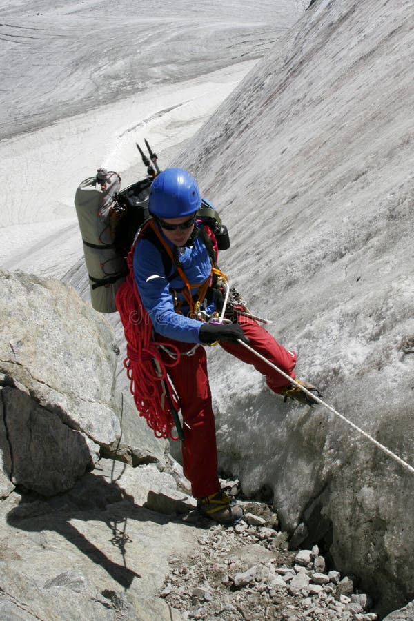 Alpinist on glacier.