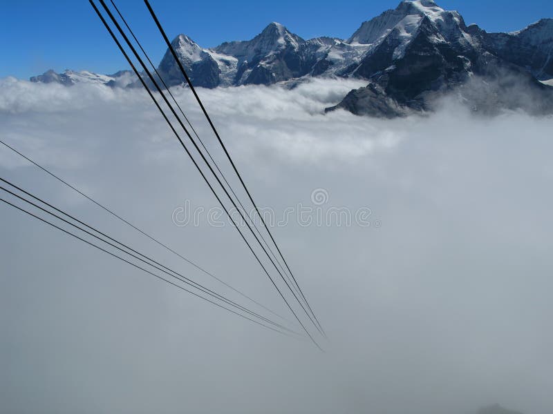 Alps with mist and cable car