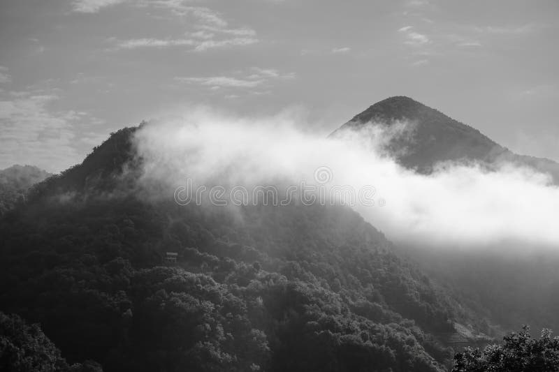 Alps mountains in clouds, black and white