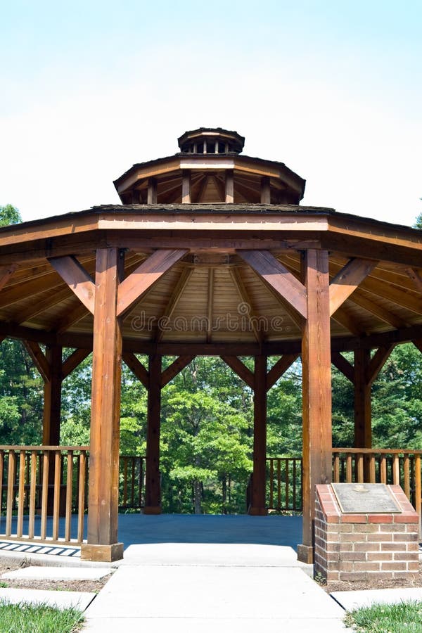 Wooden gazebo with concrete floor. Located in a public park. Wooden gazebo with concrete floor. Located in a public park.