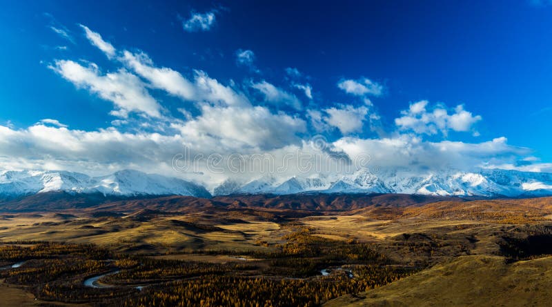 Altay. Mountains. Golden autumn. Blue sky.