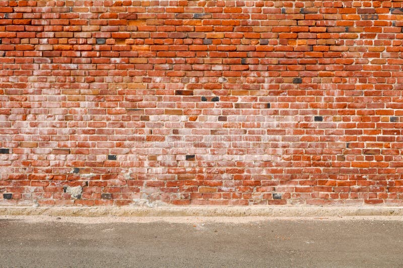 Alte Backsteinmauer-und Straßen-Straße lizenzfreies stockfoto Alte Backsteinmauer-und Straßen-Straße lizenzfreies stockfoto